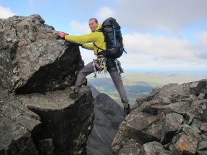 David from the Skye Cuillin ridge bridging a gully